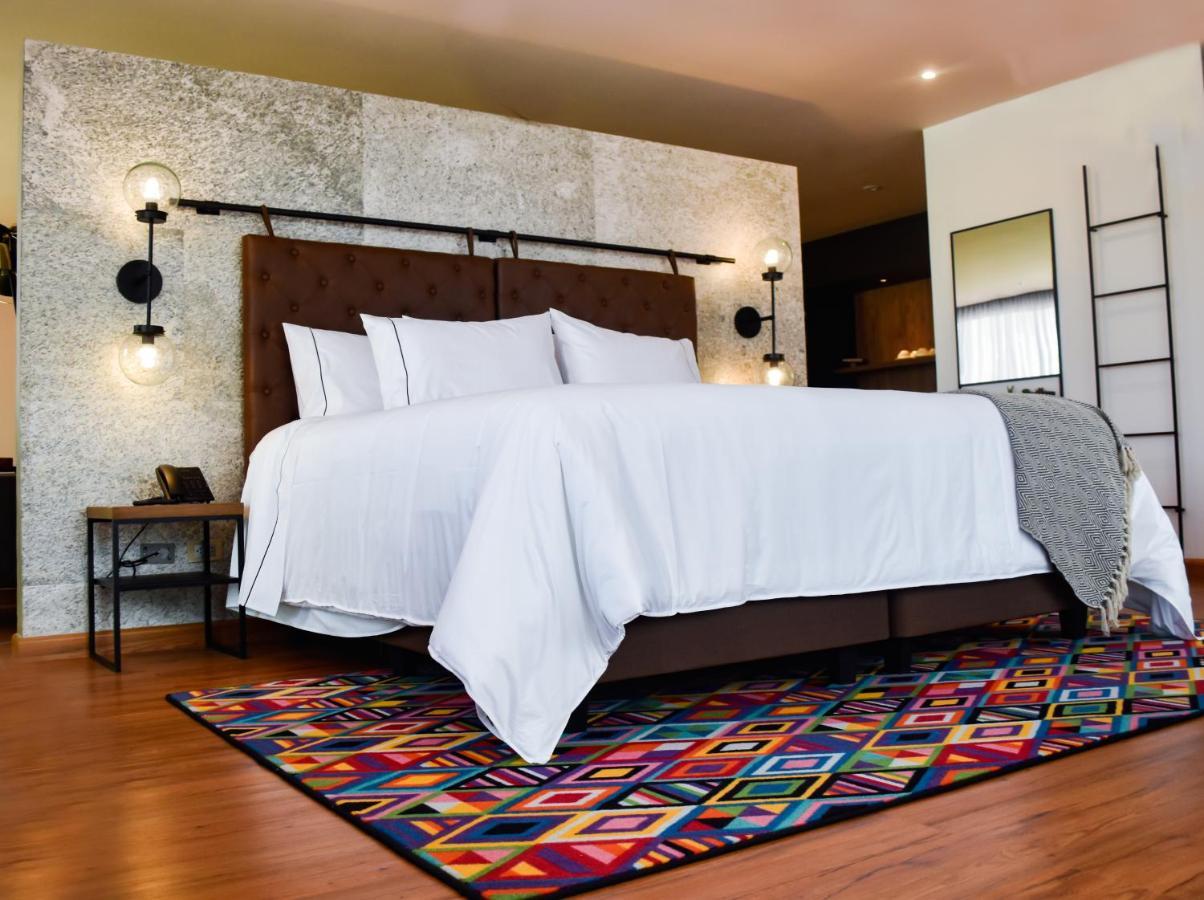 Hotel V1501 Pasto Exteriör bild A bedroom with a carpet